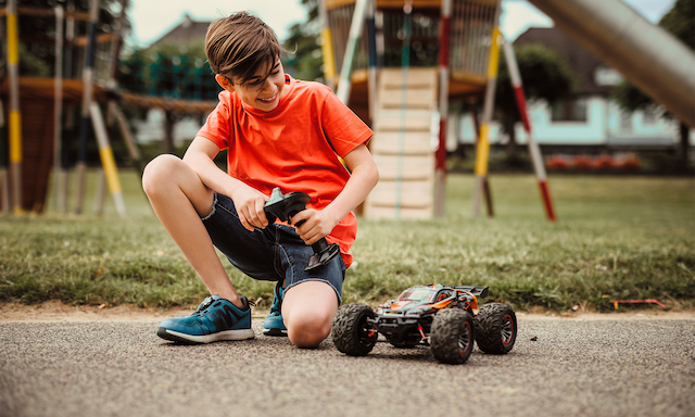 kid playing with rc car