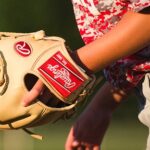 a softball player wearing a softball mitt